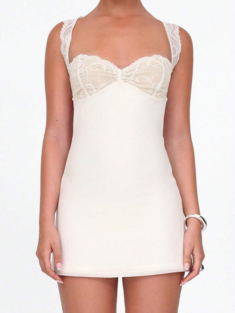Women's sleeveless white lace-trimmed bustier mini dress featuring backless tie-up detail and slim fit A-line silhouette.