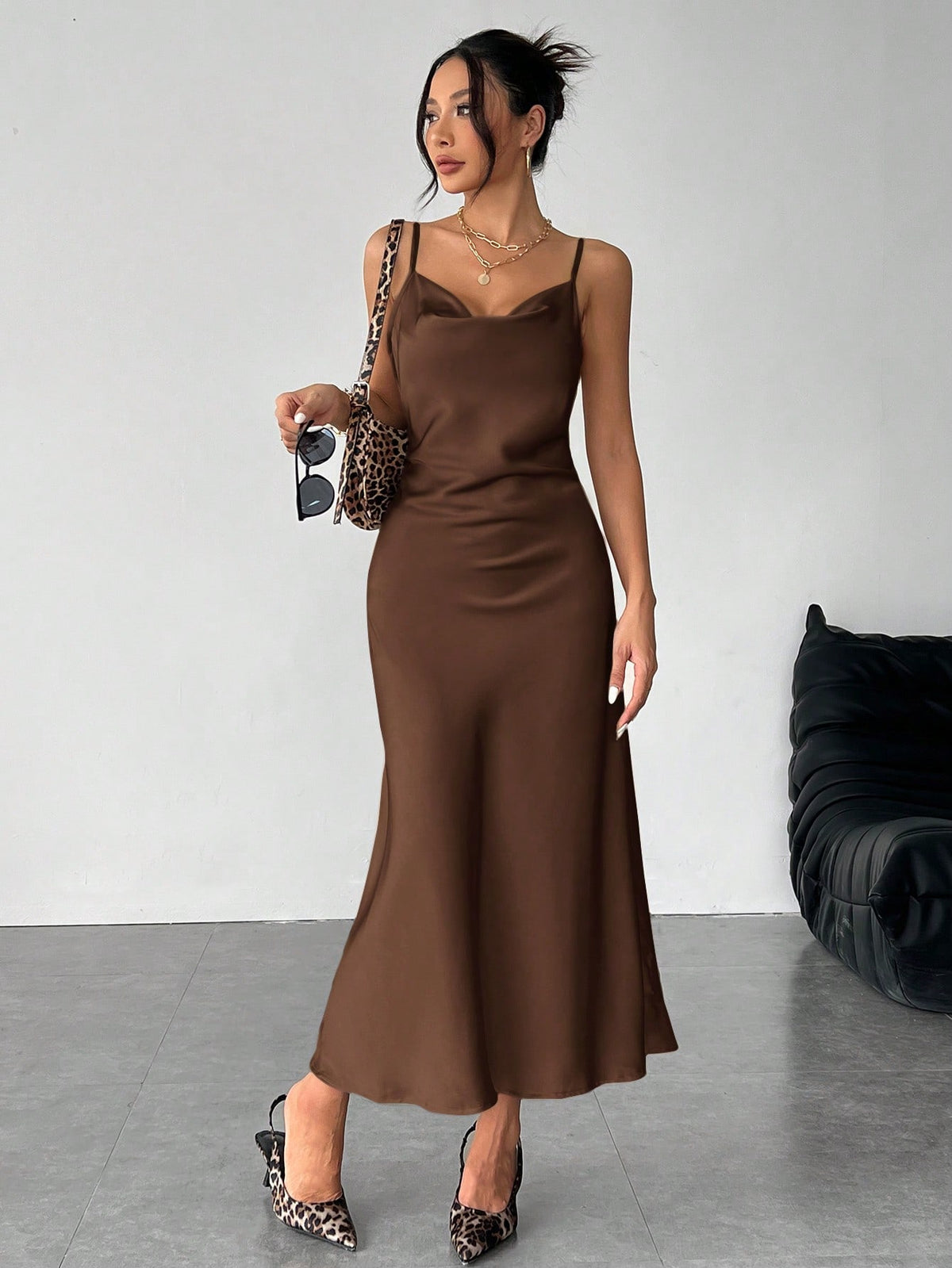 Women's long apricot satin cami dress featuring a draped swing collar, spaghetti straps, backless zipper back, and mermaid hem.
