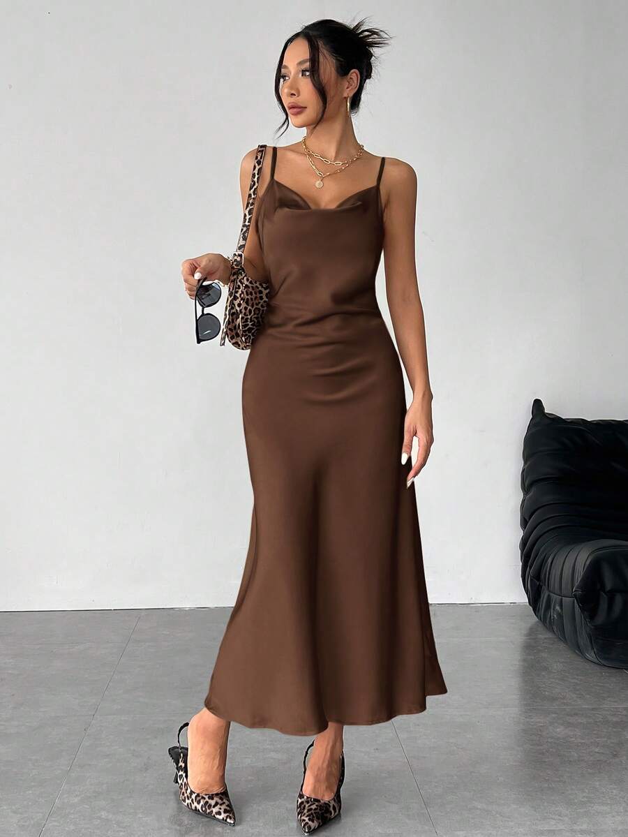 Women's long apricot satin cami dress featuring a draped swing collar, spaghetti straps, backless zipper back, and mermaid hem.