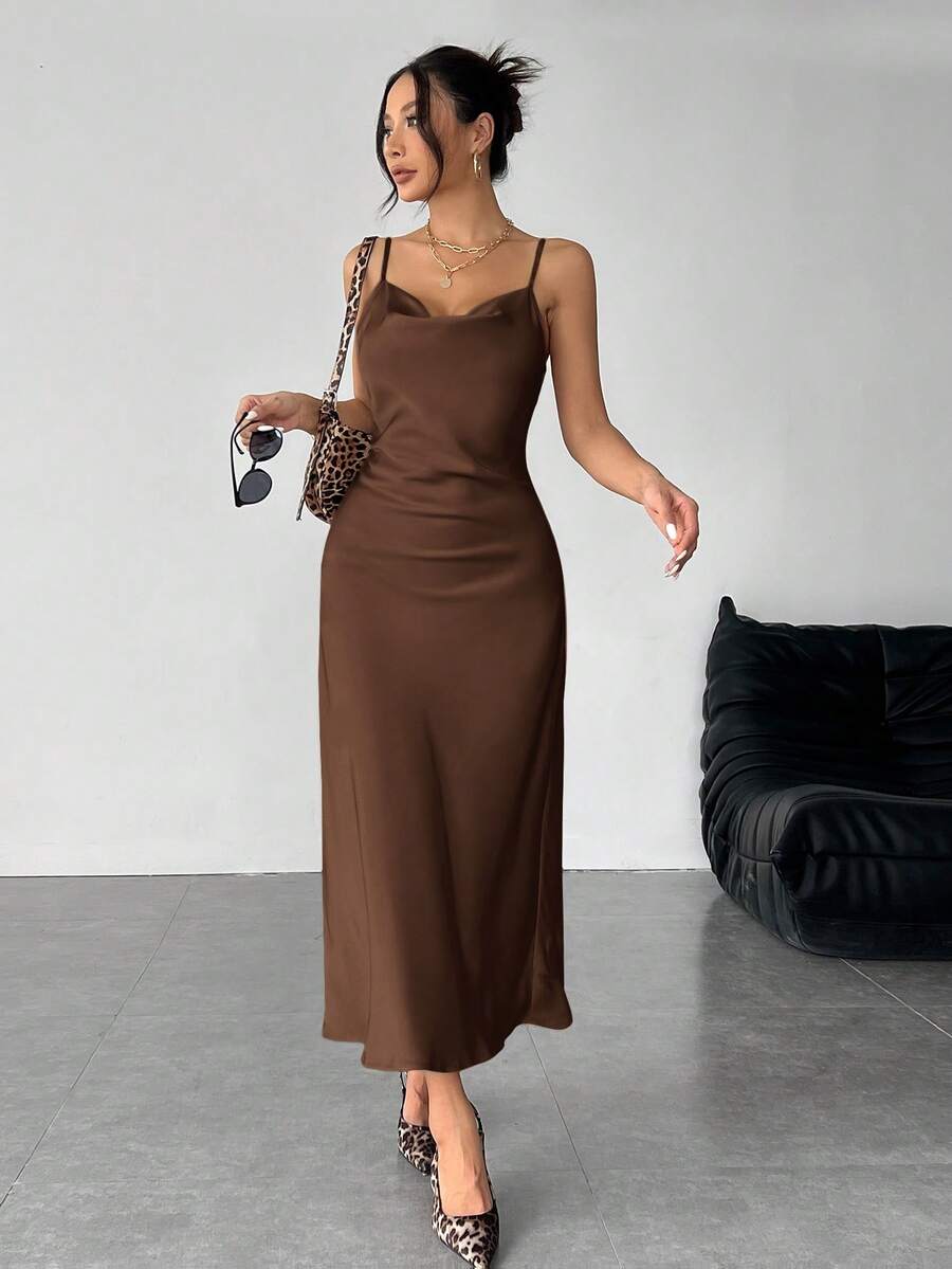 Women's long apricot satin cami dress featuring a draped swing collar, spaghetti straps, backless zipper back, and mermaid hem.