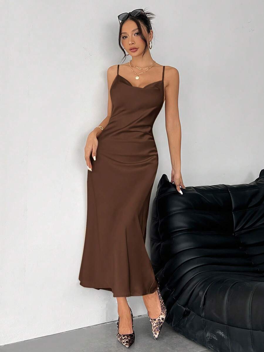 Women's long apricot satin cami dress featuring a draped swing collar, spaghetti straps, backless zipper back, and mermaid hem.