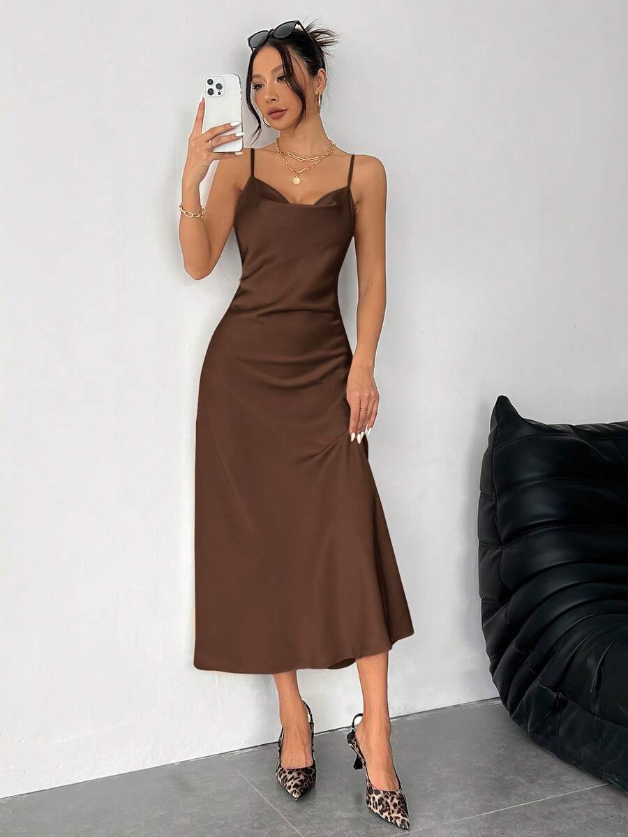 Women's long apricot satin cami dress featuring a draped swing collar, spaghetti straps, backless zipper back, and mermaid hem.