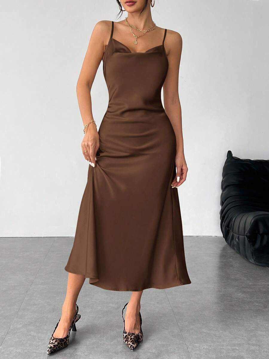 Women's long apricot satin cami dress featuring a draped swing collar, spaghetti straps, backless zipper back, and mermaid hem.