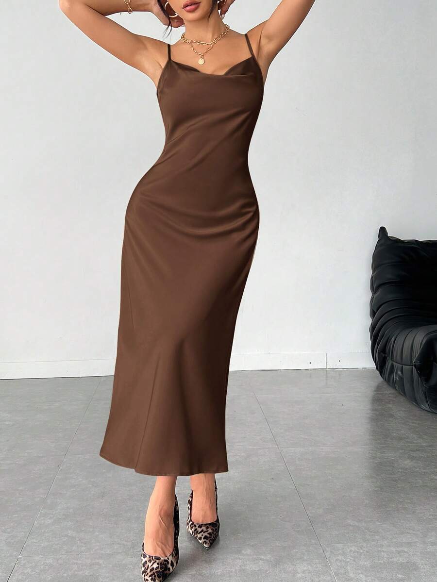 Women's long apricot satin cami dress featuring a draped swing collar, spaghetti straps, backless zipper back, and mermaid hem.