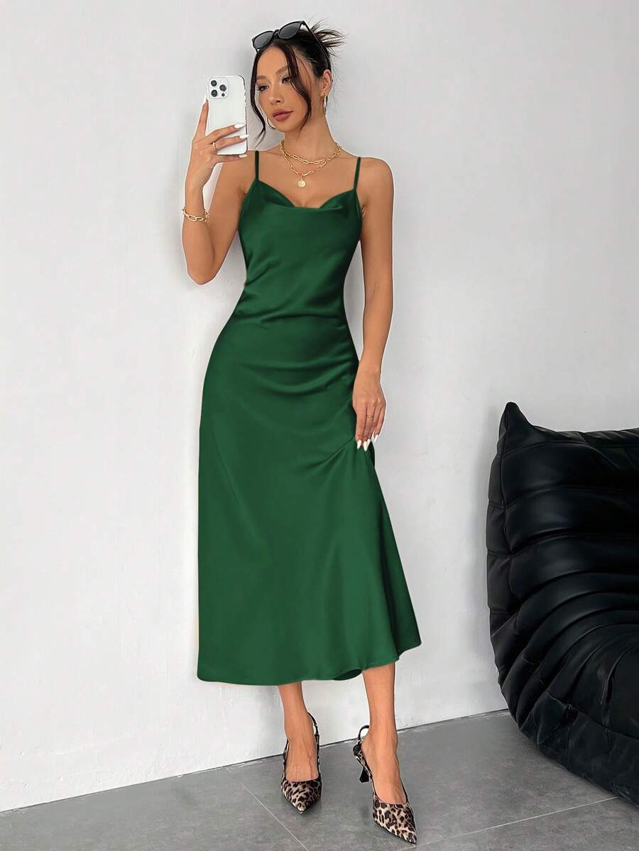 Women's long apricot satin cami dress featuring a draped swing collar, spaghetti straps, backless zipper back, and mermaid hem.
