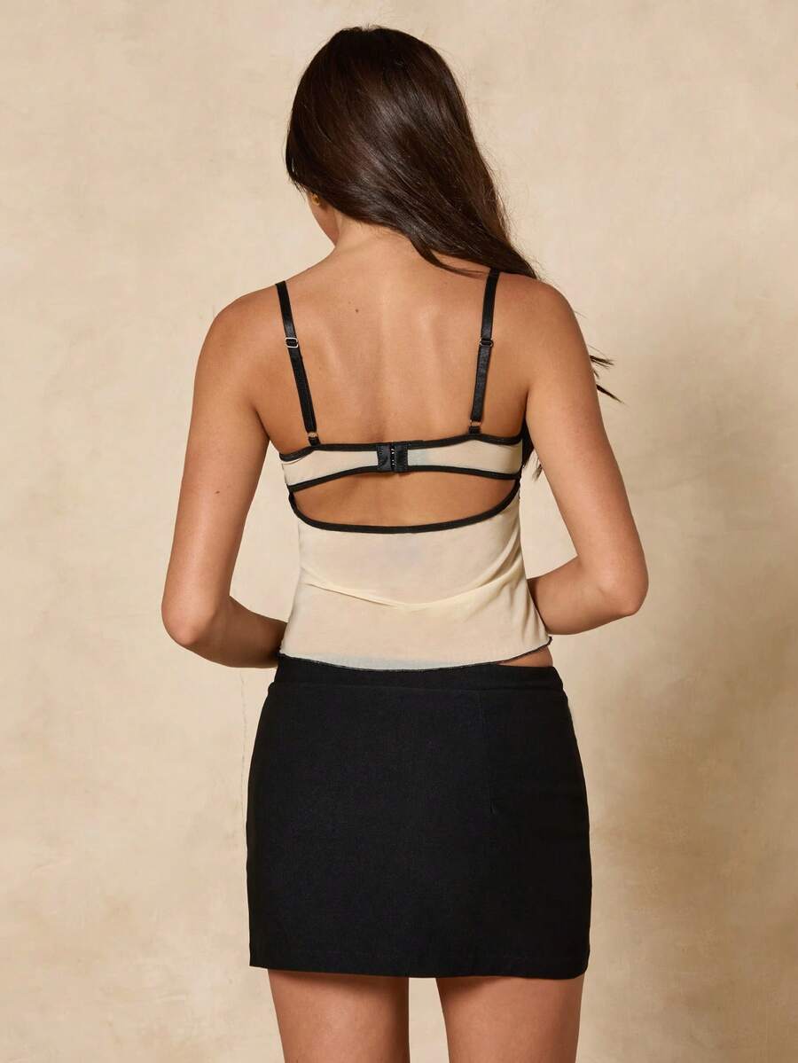 Women's black contrast lace camisole with spaghetti straps, cup detail, semi-sheer finish, and slim fit for going out or date night.