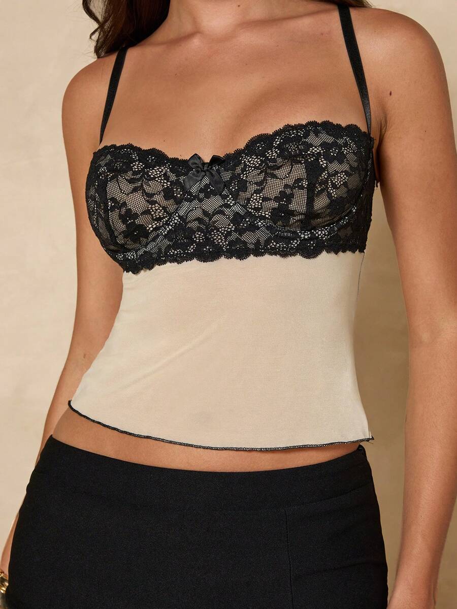 Women's black contrast lace camisole with spaghetti straps, cup detail, semi-sheer finish, and slim fit for going out or date night.
