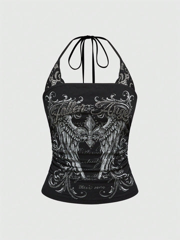 Woman wearing a black Y2K concert print 2-in-1 contrast lace halter crop top featuring a backless design with knot details.