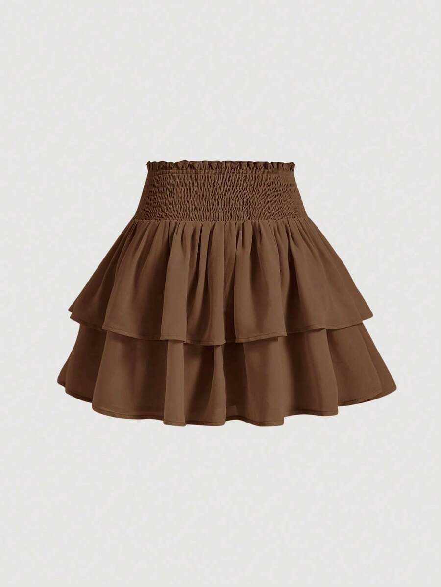 Women's high waist tiered ruffle layered mini skort in black featuring shirred details and ruffle hem.
