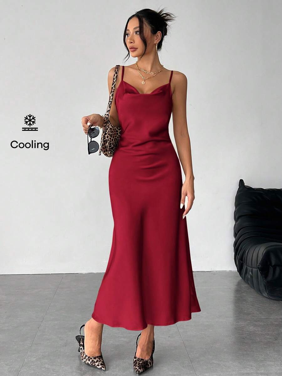 Women's long apricot satin cami dress featuring a draped swing collar, spaghetti straps, backless zipper back, and mermaid hem.