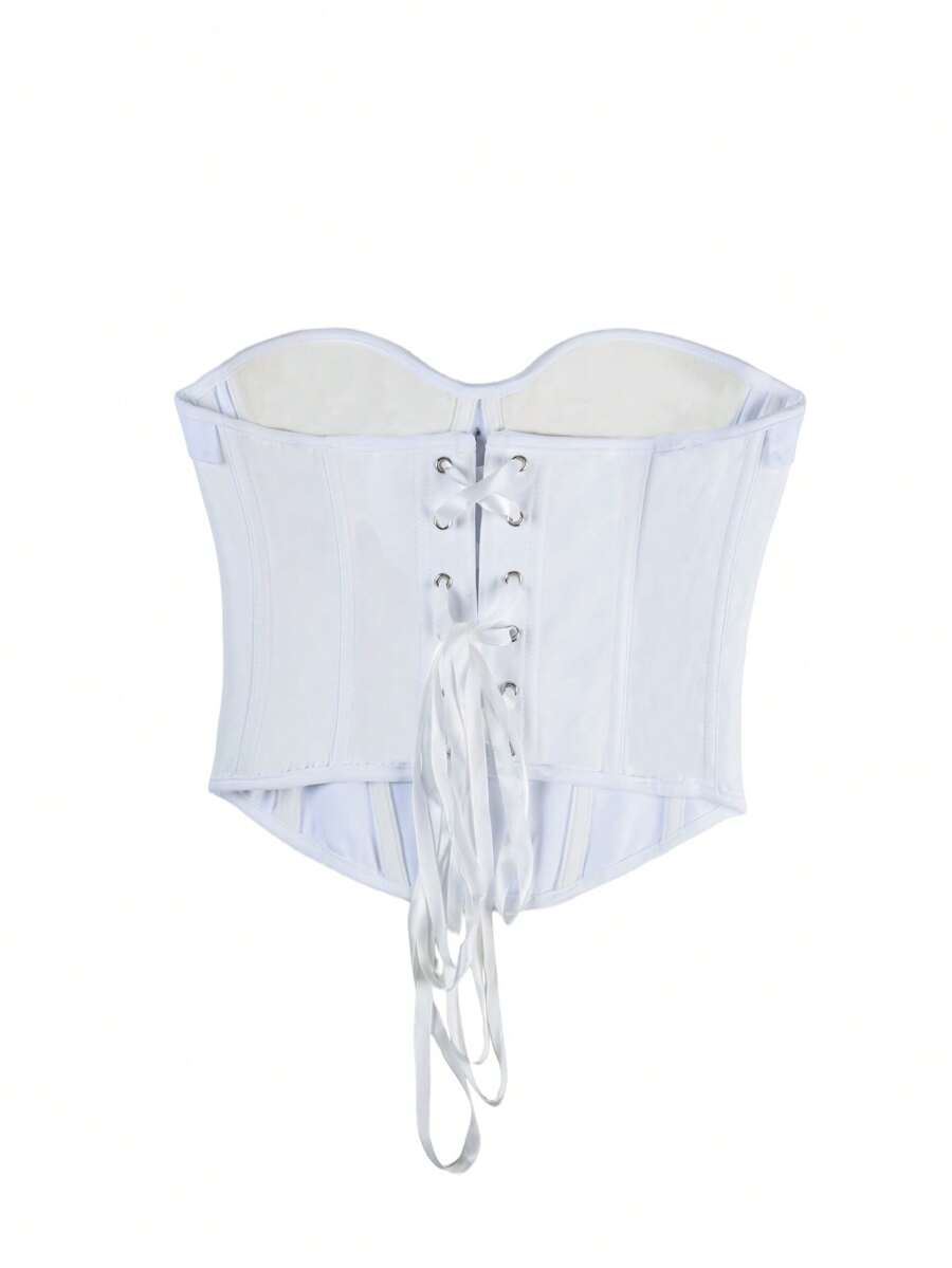 Women's white cropped tube top featuring a strapless backless design and asymmetrical hem in a slim fit style.