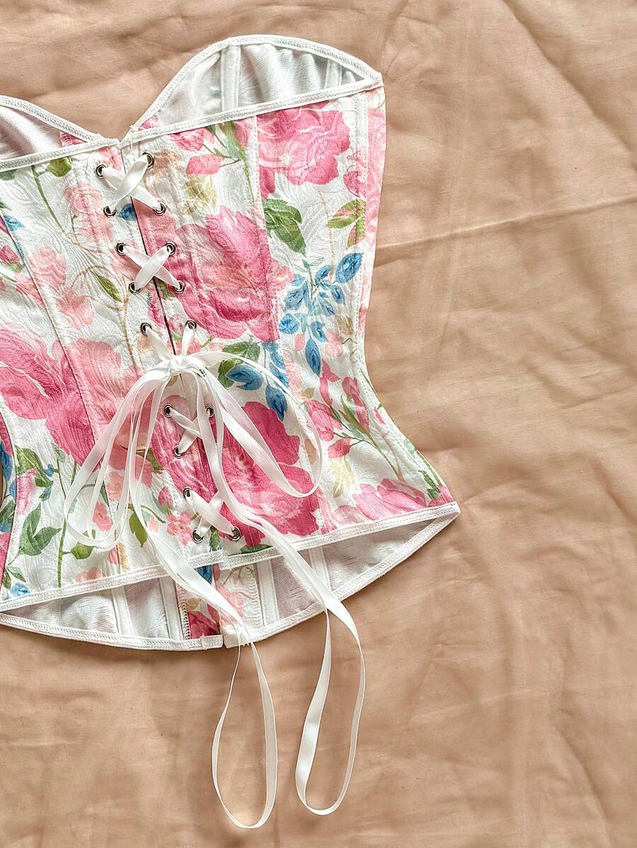 Women's apricot retro floral print bandeau crop top featuring a strapless asymmetrical neckline, lace-up back tie detail, and ruched slim fit woven fabric.