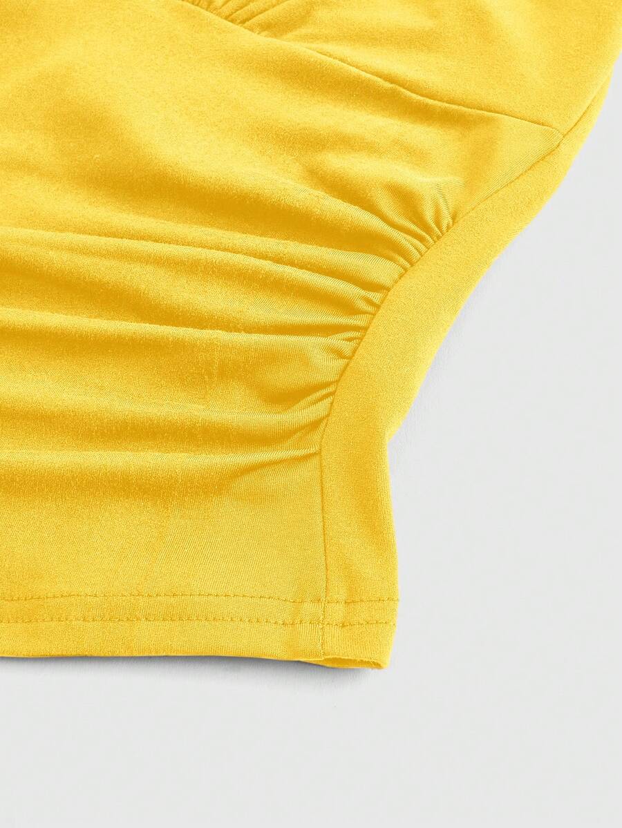 Women's halter crop tank top featuring a backless silhouette and ruched detailing in a slim fit design.