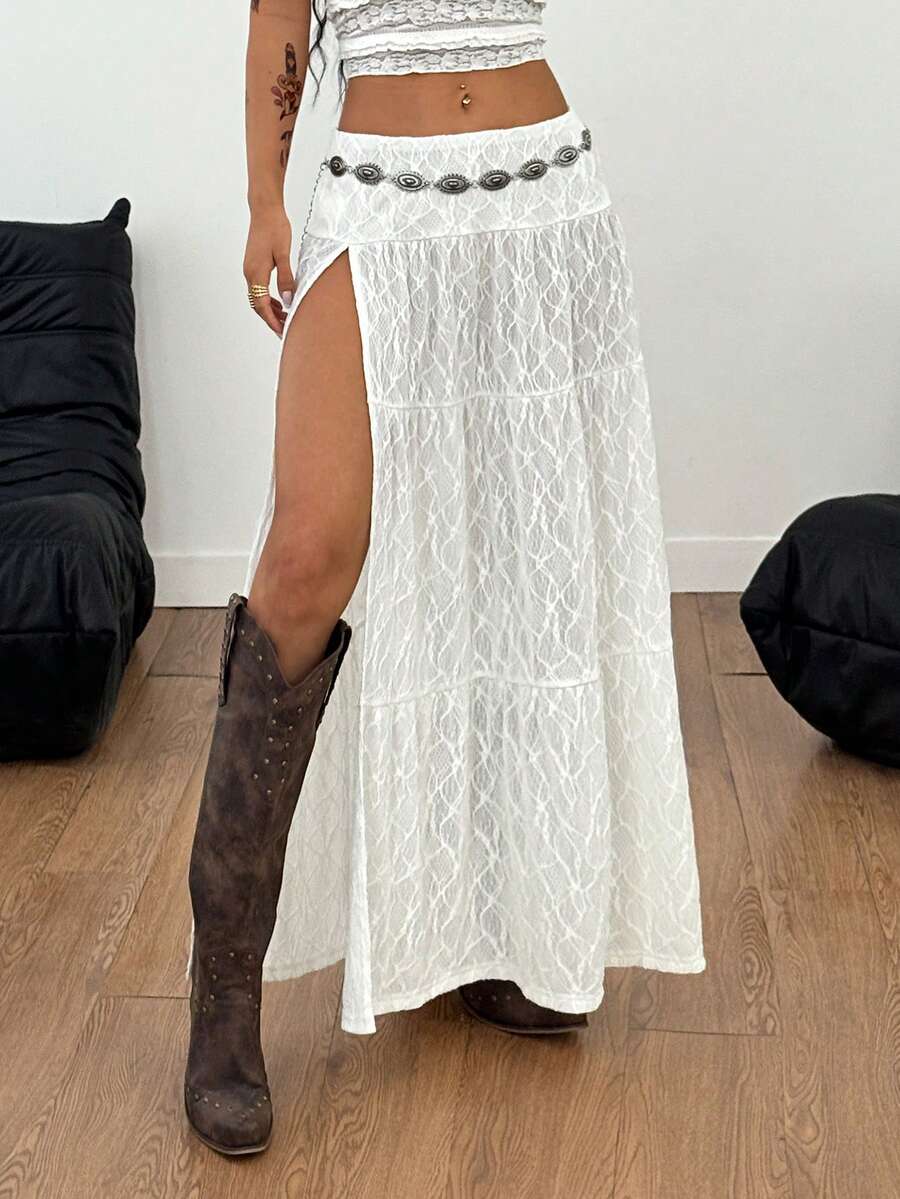 Women's black low waist split thigh long skirt featuring semi-sheer textured fabric and a flared skinny fit.