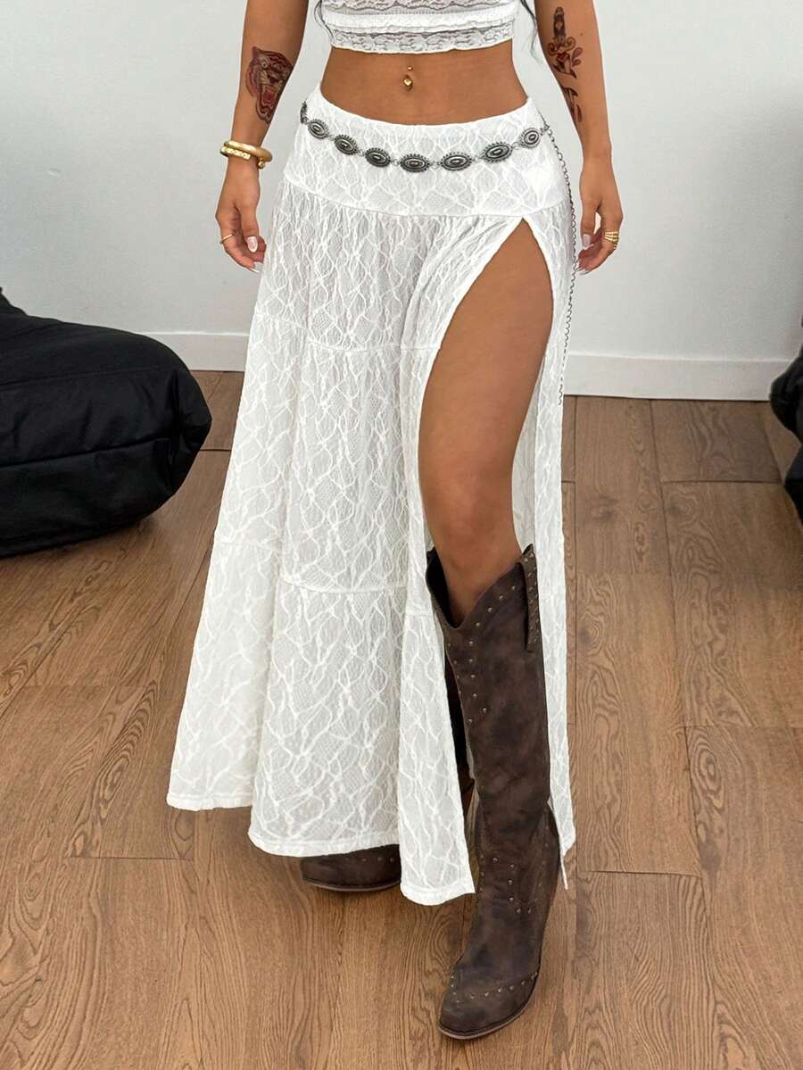 Women's black low waist split thigh long skirt featuring semi-sheer textured fabric and a flared skinny fit.
