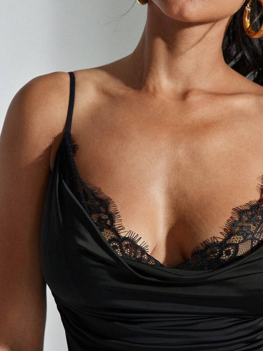 Women's solid color draped neck cami top featuring contrast lace trim, backless design, and delicate spaghetti straps in a slim fit style.
