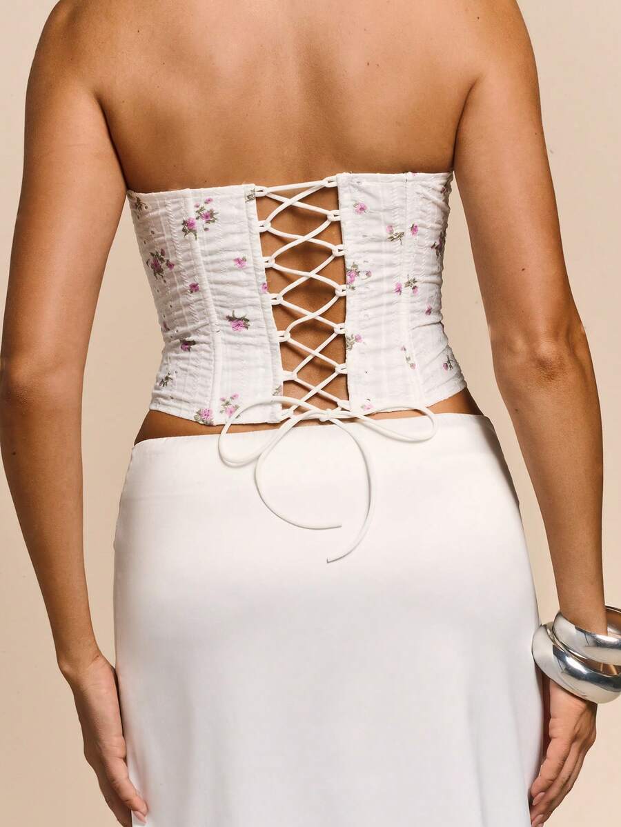Women's white ditsy floral frill trim strapless corset tube top featuring a sweetheart neckline and lace-up back design