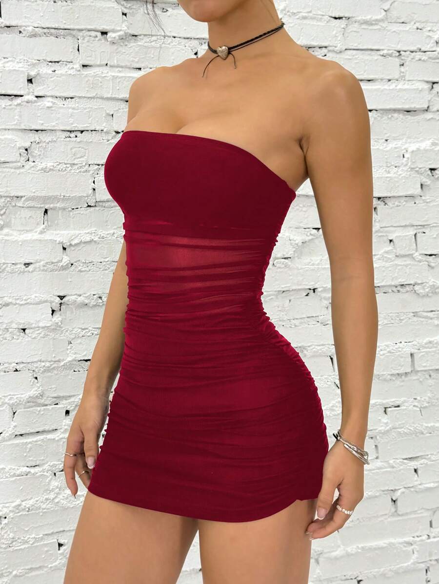 Women's blue strapless ruched mesh bodycon mini dress with backless design and slim fit for a night out.