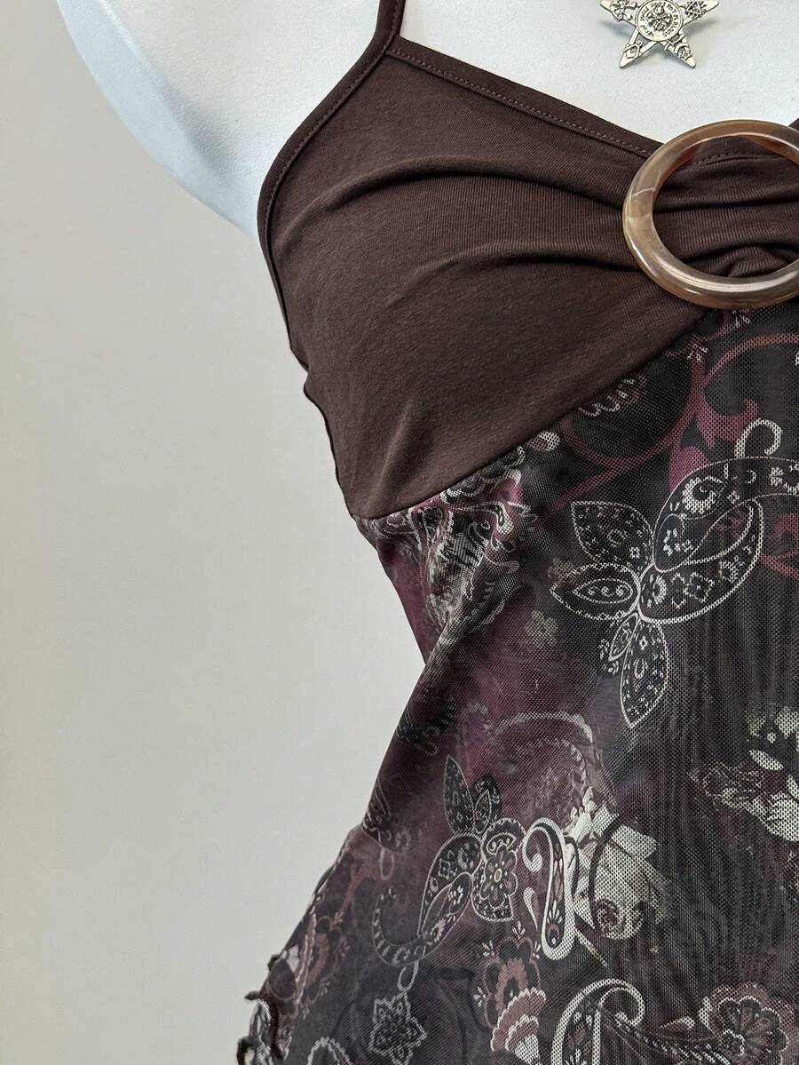 Women's backless halter cami top featuring a paisley print, sleeveless design, and an asymmetrical hem in knitted fabric.