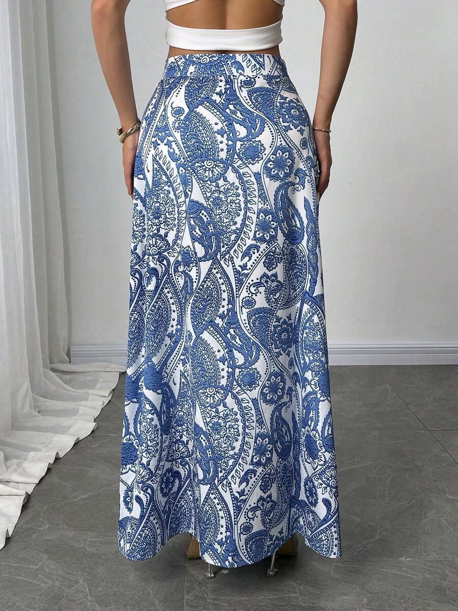 Women's black boho ditsy floral print maxi skirt featuring a high waist and a stylish split thigh slit detail.