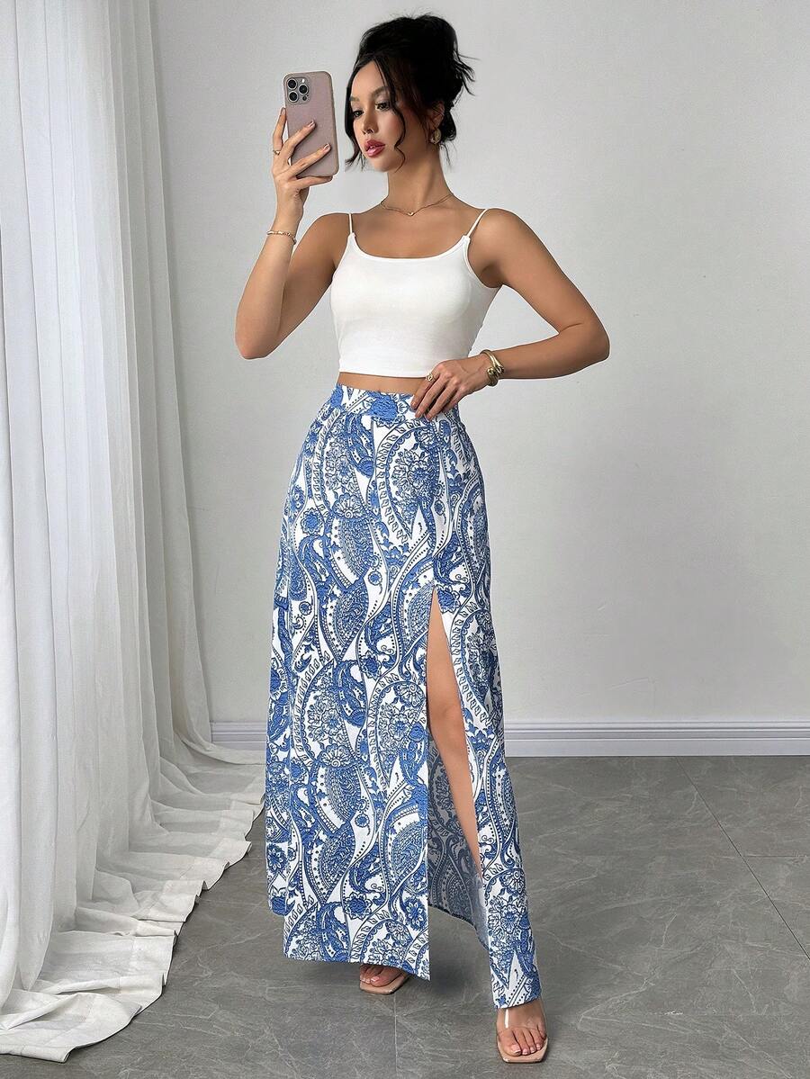 Women's black boho ditsy floral print maxi skirt featuring a high waist and a stylish split thigh slit detail.