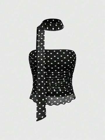 Women's black polka dot strapless tube top made of ruched mesh fabric featuring an asymmetrical hem and matching scarf.