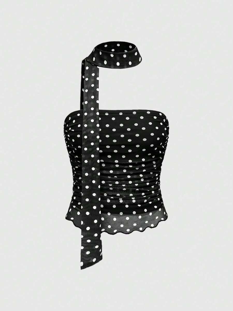 Women's black polka dot strapless tube top made of ruched mesh fabric featuring an asymmetrical hem and matching scarf.