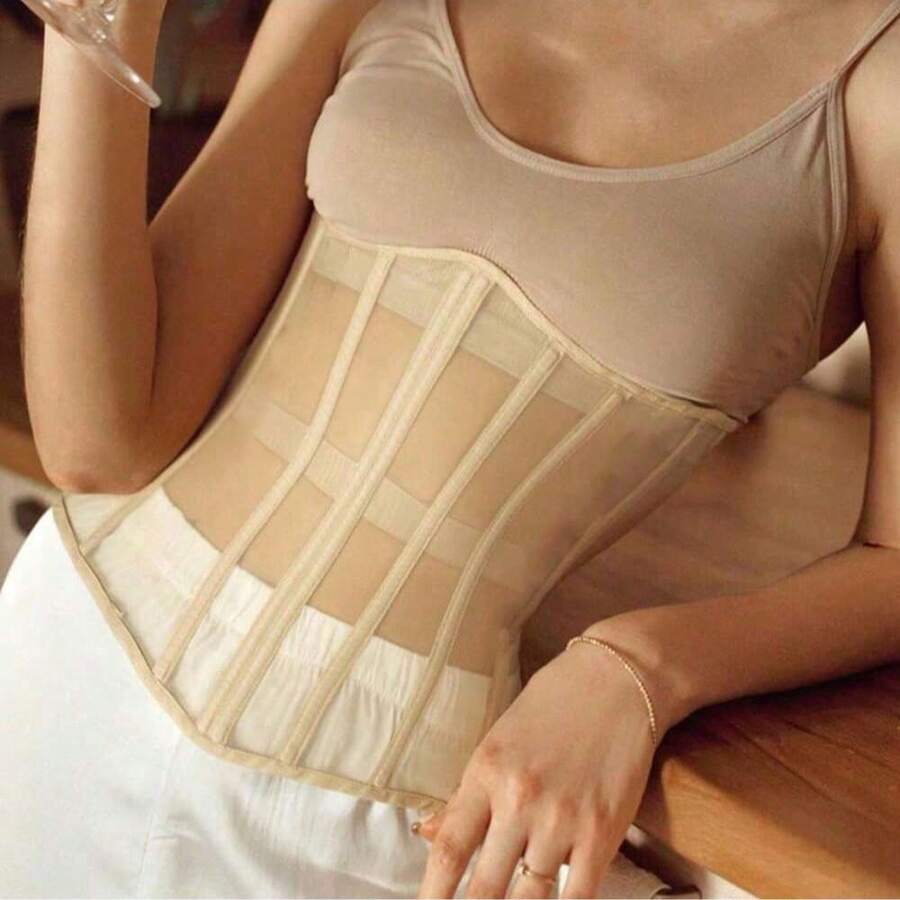 Women's apricot mesh shaping short corset with a lace-up front detail and slim-fit waist shaper design.