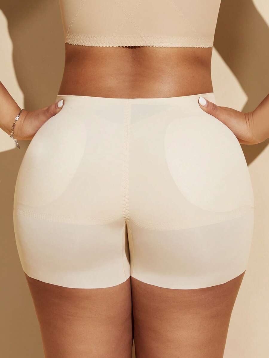 Women's black seamless waist trainer shorts featuring tummy control and butt lifting pads