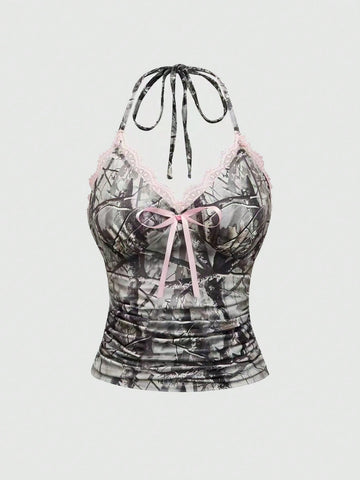 Women's slim fit camo crop tank top styled with contrast lace trim, front bow accent, and matching arm sleeves.