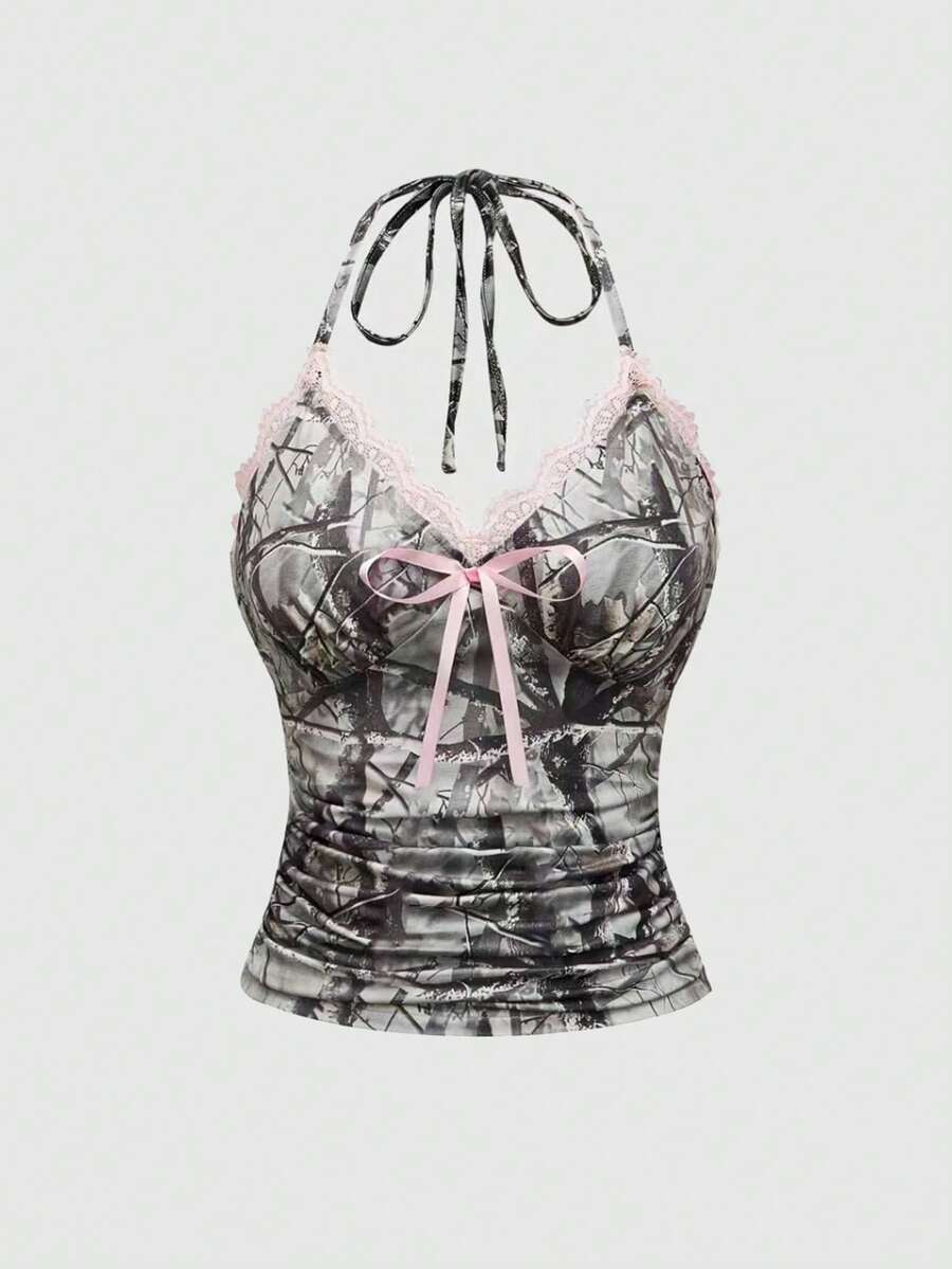 Women's slim fit camo crop tank top styled with contrast lace trim, front bow accent, and matching arm sleeves.