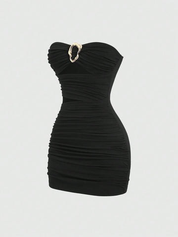 Women's black strapless bodycon mini dress featuring ruched detailing, cut-out design with ring accent, mid-waist pencil hem, and slim fit knitted stretch fabric.