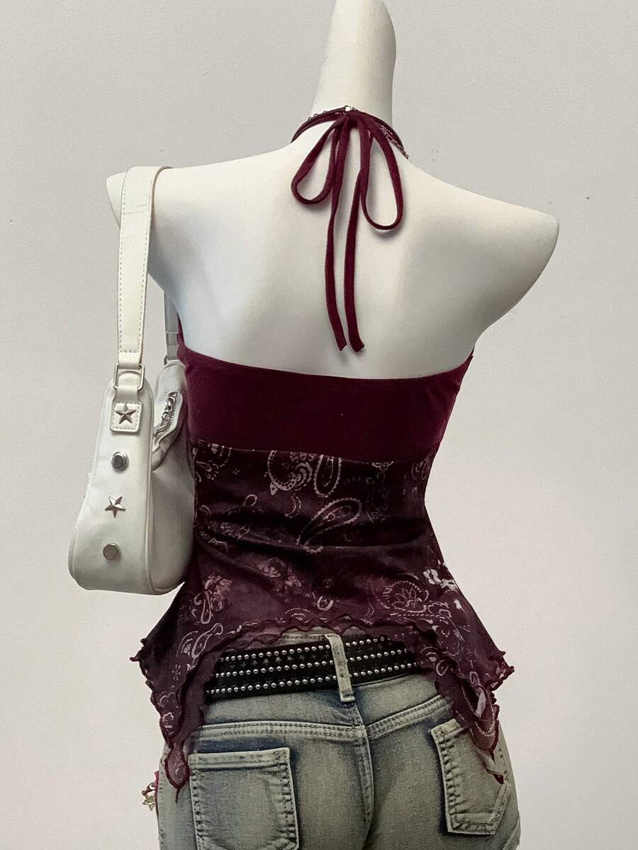 Women's backless halter cami top featuring a paisley print, sleeveless design, and an asymmetrical hem in knitted fabric.