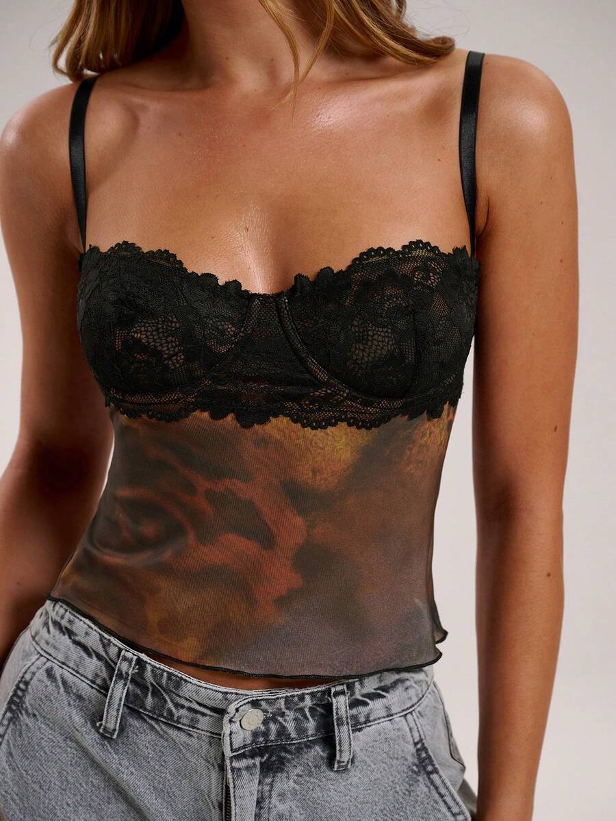 Women's black contrast lace camisole with spaghetti straps, cup detail, semi-sheer finish, and slim fit for going out or date night.