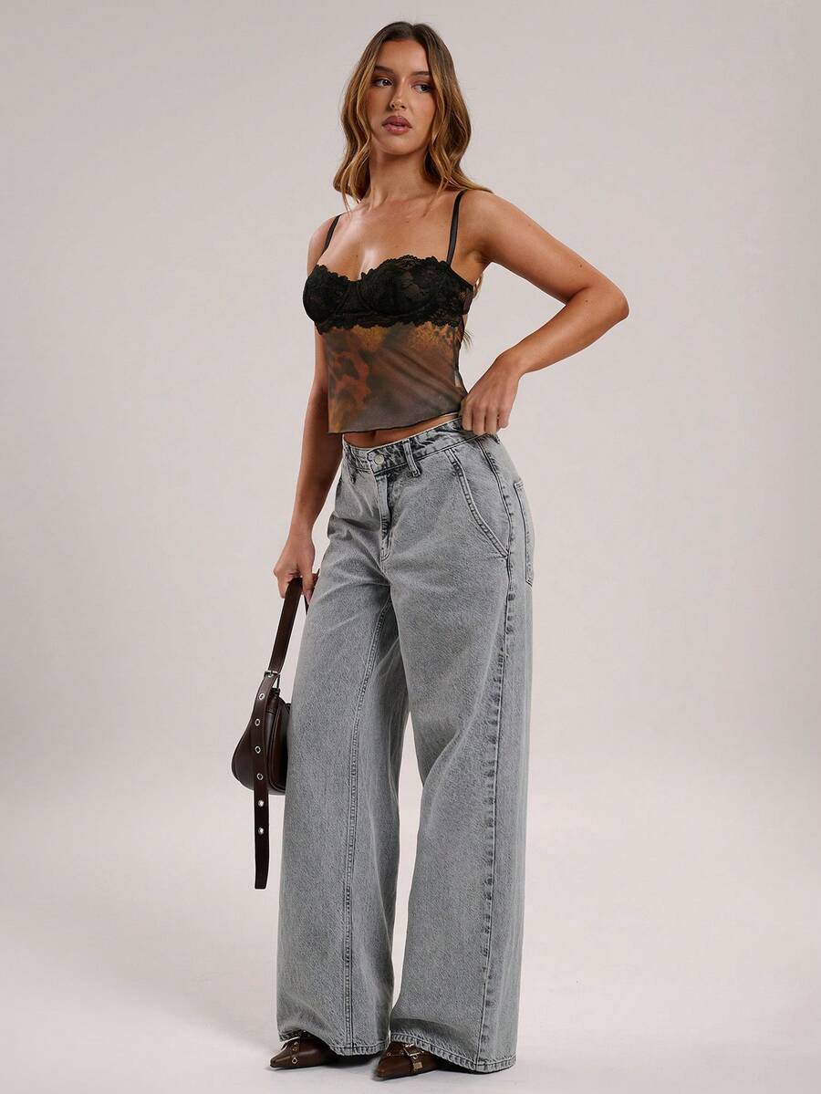 Women's black contrast lace camisole with spaghetti straps, cup detail, semi-sheer finish, and slim fit for going out or date night.
