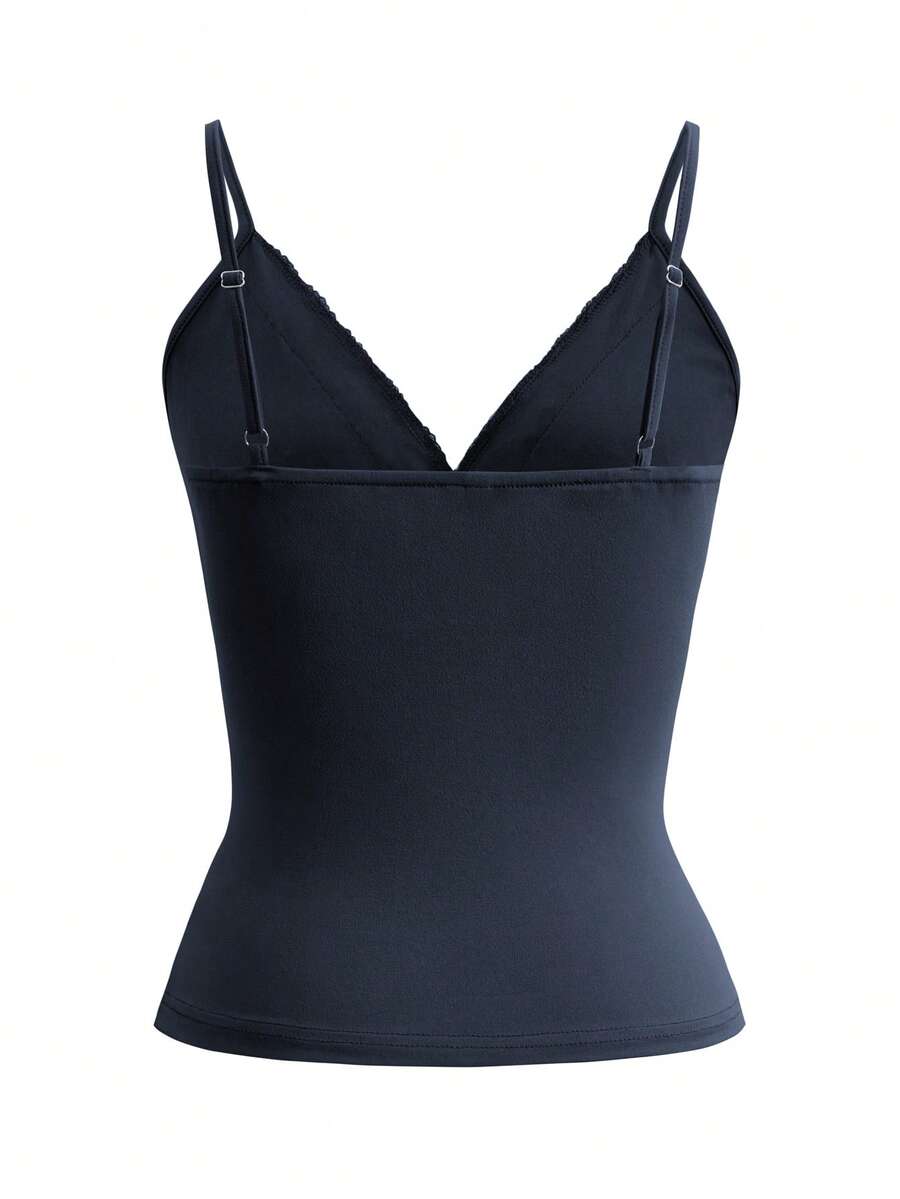 Women's deep V-neck camisole top featuring contrast hollow lace trim, cutout detail, and thin spaghetti straps.