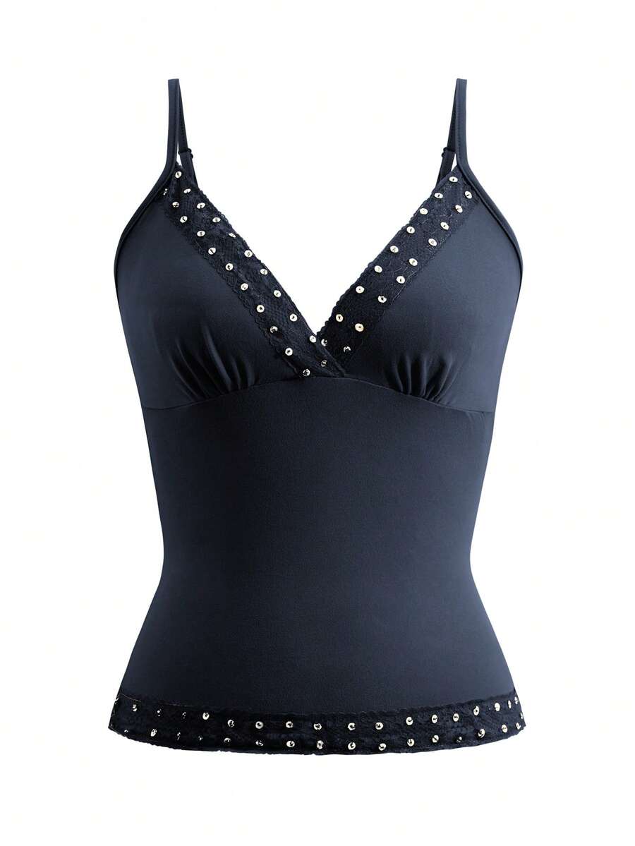 Women's deep V-neck camisole top featuring contrast hollow lace trim, cutout detail, and thin spaghetti straps.