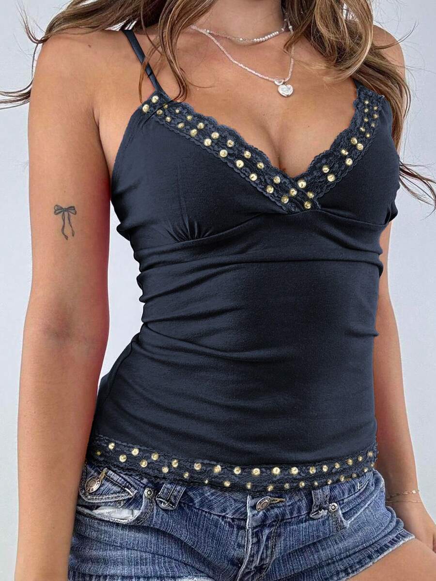 Women's deep V-neck camisole top featuring contrast hollow lace trim, cutout detail, and thin spaghetti straps.