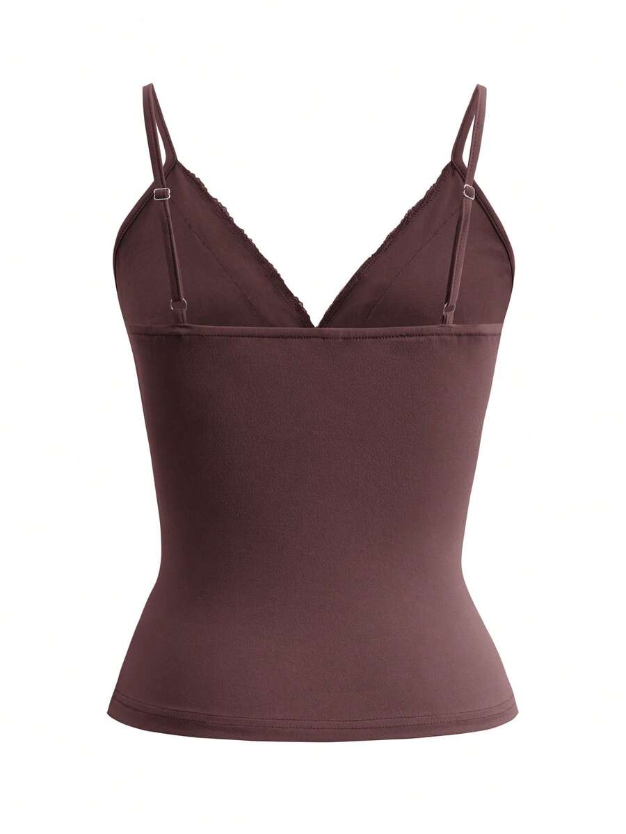 Women's deep V-neck camisole top featuring contrast hollow lace trim, cutout detail, and thin spaghetti straps.