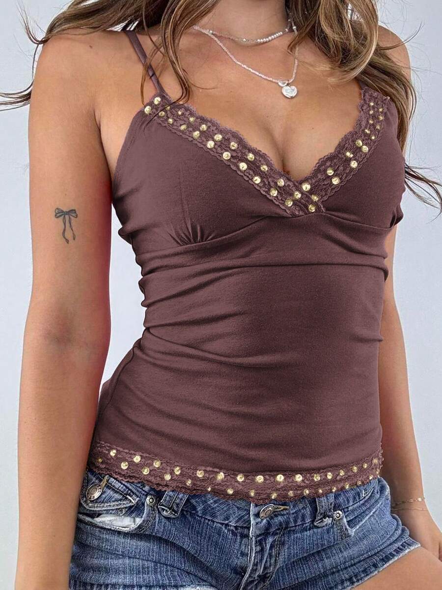 Women's deep V-neck camisole top featuring contrast hollow lace trim, cutout detail, and thin spaghetti straps.