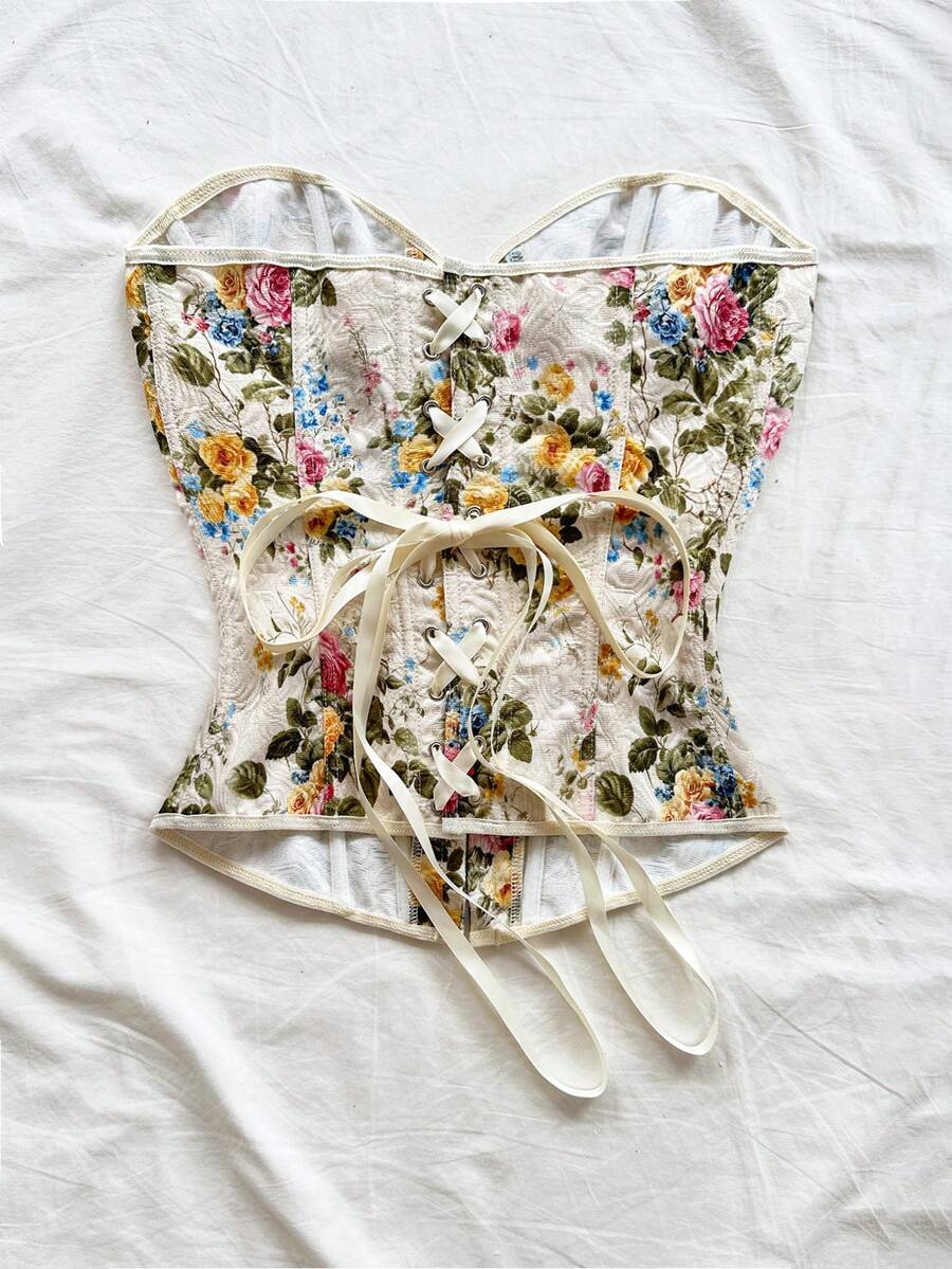 Women's apricot retro floral print bandeau crop top featuring a strapless asymmetrical neckline, lace-up back tie detail, and ruched slim fit woven fabric.