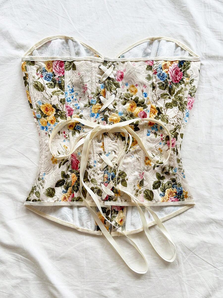 Women's apricot retro floral print bandeau crop top featuring a strapless asymmetrical neckline, lace-up back tie detail, and ruched slim fit woven fabric.