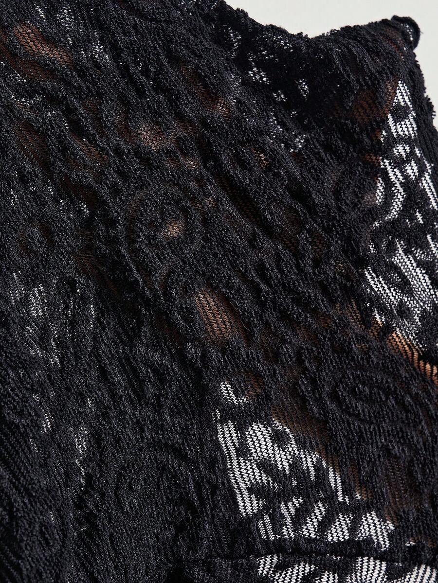 Black boho paisley knit camisole top featuring contrast lace details, spaghetti straps, and a slim crop fit for women