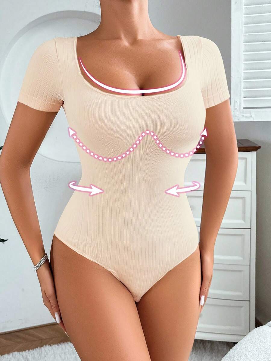 Women's seamless waist cincher bodysuit featuring short sleeves, briefs bottom, and rib-knit texture.