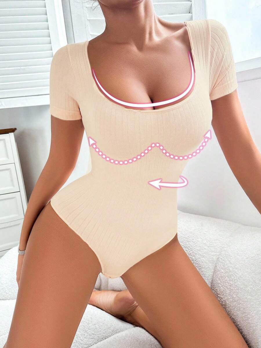 Women's seamless waist cincher bodysuit featuring short sleeves, briefs bottom, and rib-knit texture.