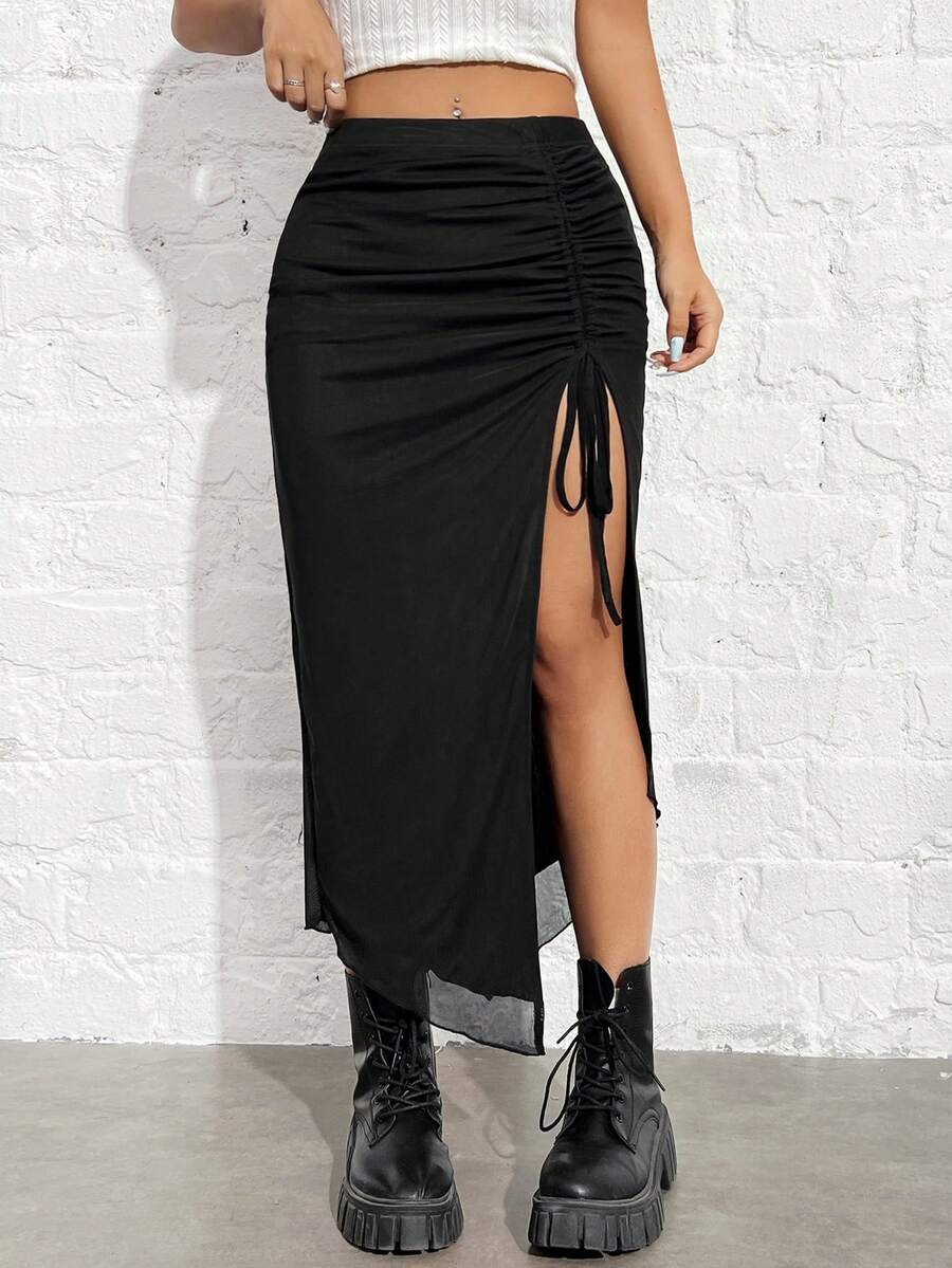 Women's black high-waisted bodycon long skirt featuring a drawstring split thigh detail and mesh fabric.