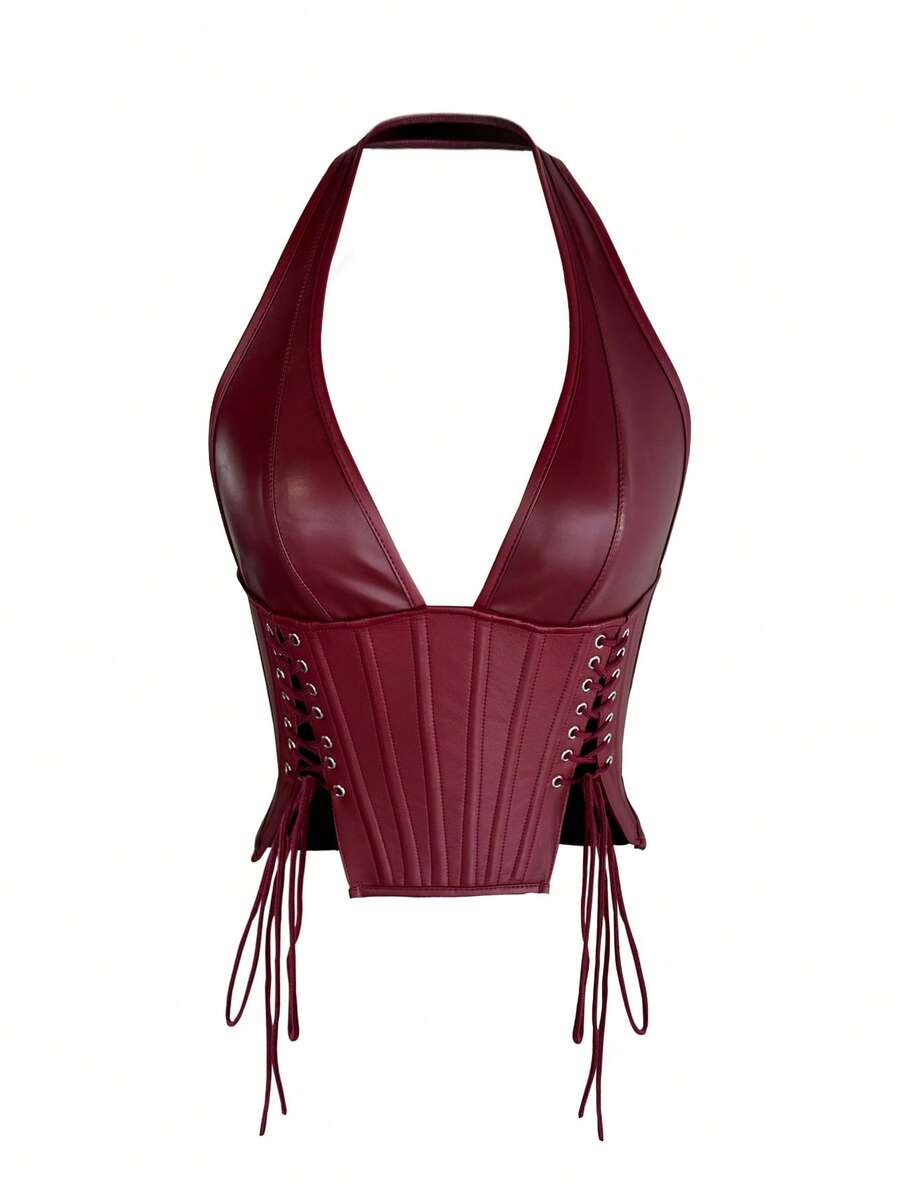 Black PU leather halter crop top for women with a backless design, split detail, tie-back closure, and grommet eyelets.