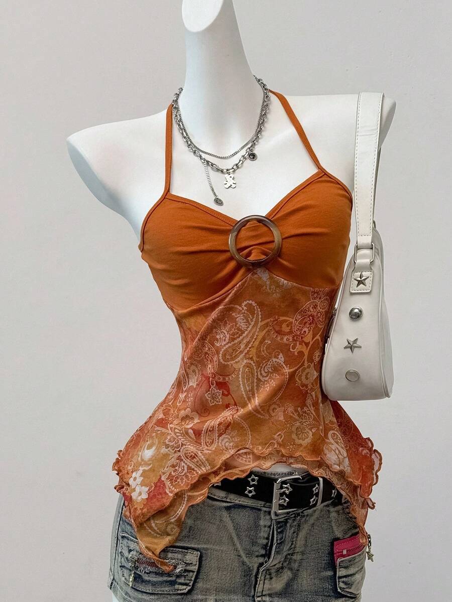 Women's backless halter cami top featuring a paisley print, sleeveless design, and an asymmetrical hem in knitted fabric.