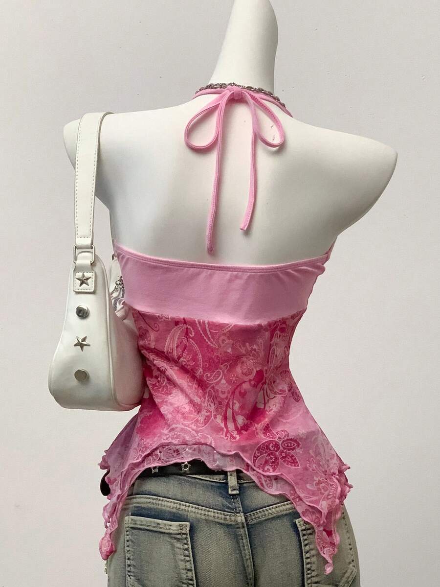Women's backless halter cami top featuring a paisley print, sleeveless design, and an asymmetrical hem in knitted fabric.