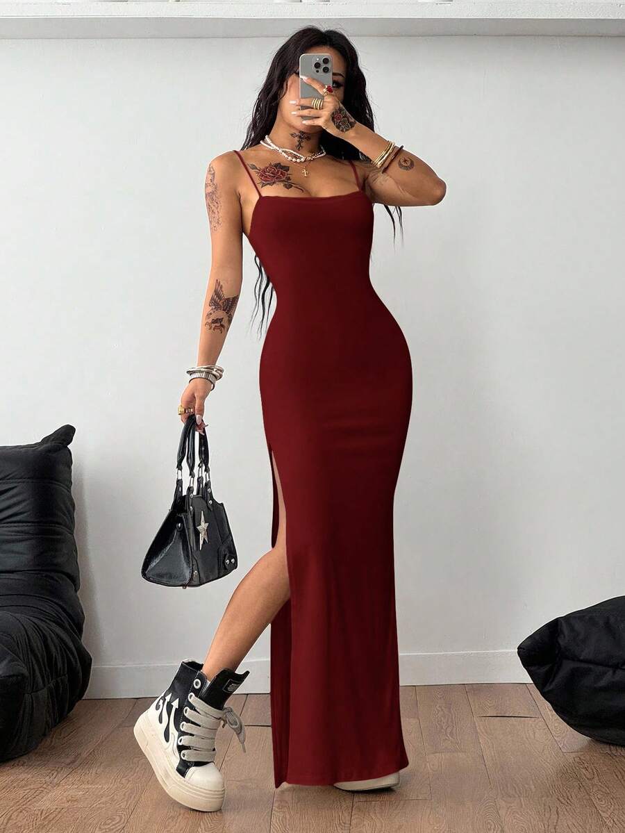 Women's Y2K backless spaghetti strap maxi dress featuring a lace-up back and high split thigh in black knitted fabric.